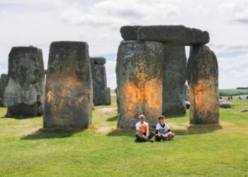 Climate protesters spray paint Stonehenge orange